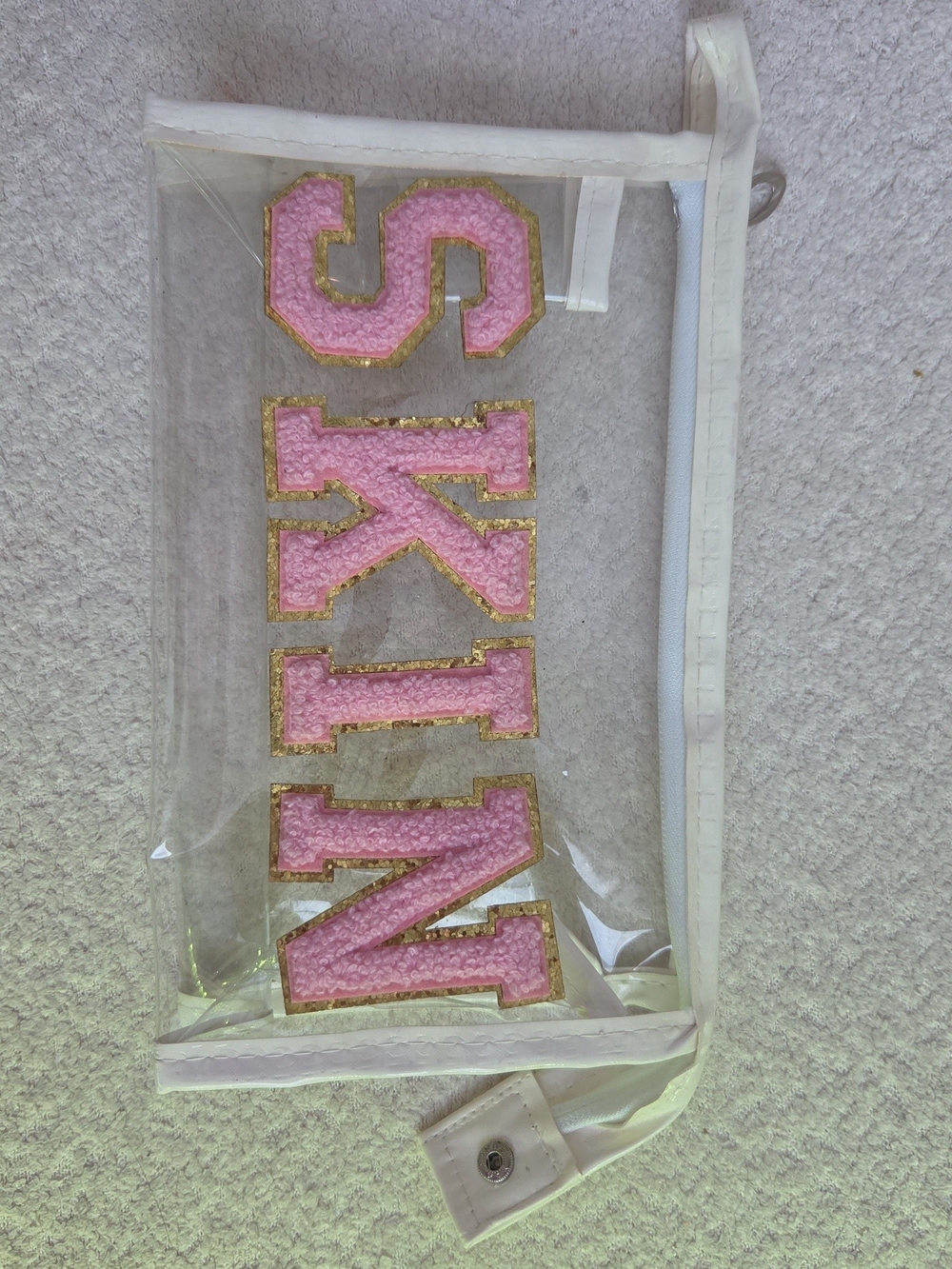 Clear Cosmetic Bag with Pink 'SKIN' Lettering